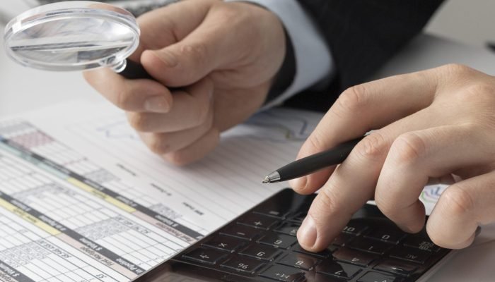 business-man-calculating-finance-numbers